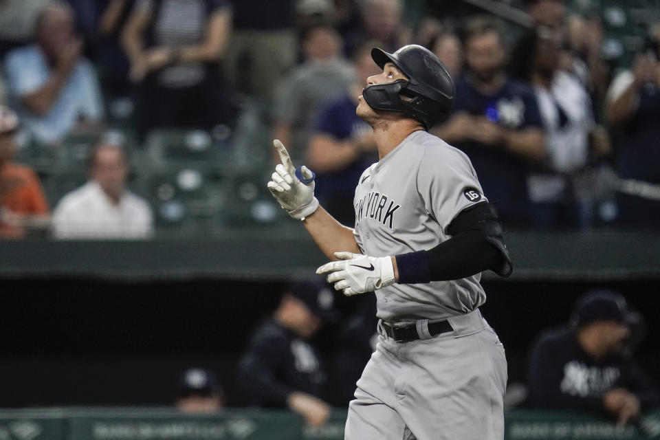 New York Yankees' Aaron Judge gestures after hitting a two-run home run off Baltimore Orioles starting pitcher Alexander Wells during the first inning of a baseball game, Tuesday, Sept. 14, 2021, in Baltimore. (AP Photo/Julio Cortez)