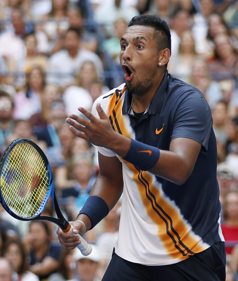 Nick Kyrgios, of Australia, reacts to a winning shot by winning shot by Roger Federer, of Switzerland, during the third round of the U.S. Open tennis tournament, Saturday, Sept. 1, 2018, in New York. (AP Photo/Jason DeCrow)