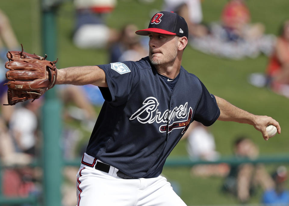 FILE - In this March 4, 2019, file photo, Atlanta Braves' Grant Dayton pitches against the Houston Astros in the sixth inning of a spring baseball exhibition game in Kissimmee, Fla. Dayton is excited to driving north for the resumption of spring training with the Braves. He knows he will not be getting any more salary. "It's going to be weird not getting a paycheck," he said. Dayton is among 11 players who received $286,500 in advances that are higher than their prorated pay. (AP Photo/John Raoux, File)