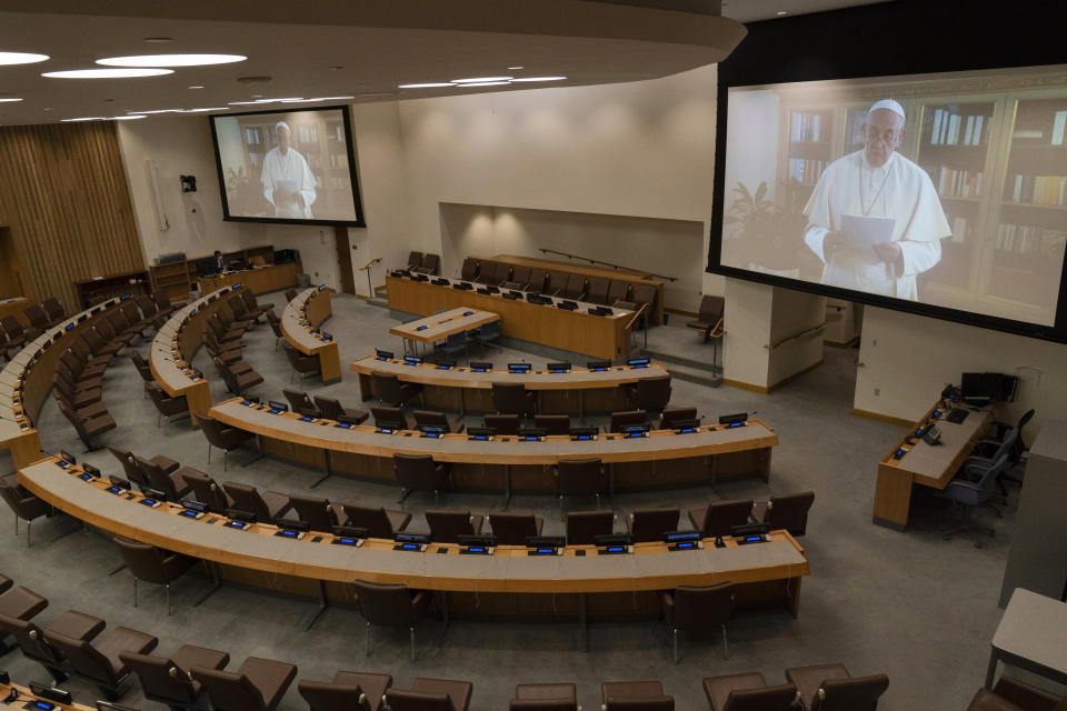 Pope Francis is seen on a video screen in an empty conference room at United Nations headquarters as he speaks in a pre-recorded message addressing the 75th session of the United Nations General Assembly the 75th session of the United Nations General Assembly, Friday, Sept. 25, 2020, at U.N. headquarters. (AP Photo/Mary Altaffer)