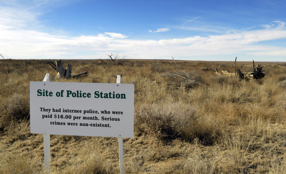 FILE - This Jan. 18, 2015, file photo, shows a sign denoting the site of the police station of Camp Amache, a former World War II-era Japanese-American internment camp in Granada, Colo. A University of Denver team is using a drone to create a 3D reconstruction of the camp in southern Colorado. The Amache effort is part of a growing movement to identify and preserve historical sites connected to people of color in the U.S. (AP Photo/Russell Contreras, File)