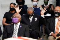 <p>Representative Gregory Meeks (D-NY) raised his hands as "Amazing Grace" played during the memorial service. </p>