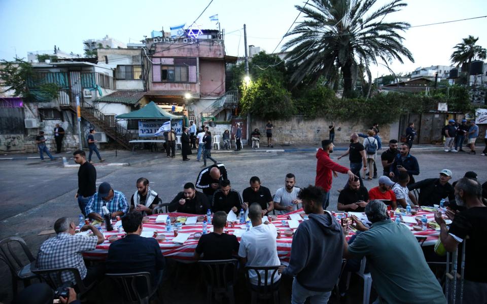 Palestinians, whom Israel want to forcibly evict from their homes, and their supporters set a dinner table for the breaking of the Ramadan fast in front of their homes at Sheikh Jarrah