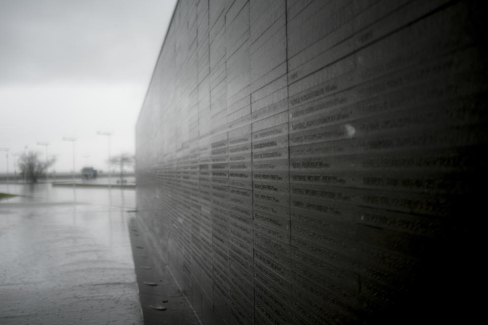 A wall in Memory Park carries the names of people who disappeared during Argentina's 1976-1983 dictatorship in Buenos Aires, Argentina, Thursday, Aug. 17, 2023. During Argentina's bloody dictatorship (1976-1983), military officials carried out the systematic theft of babies from political prisoners who were often executed and disposed of without a trace. (AP Photo/Natacha Pisarenko)