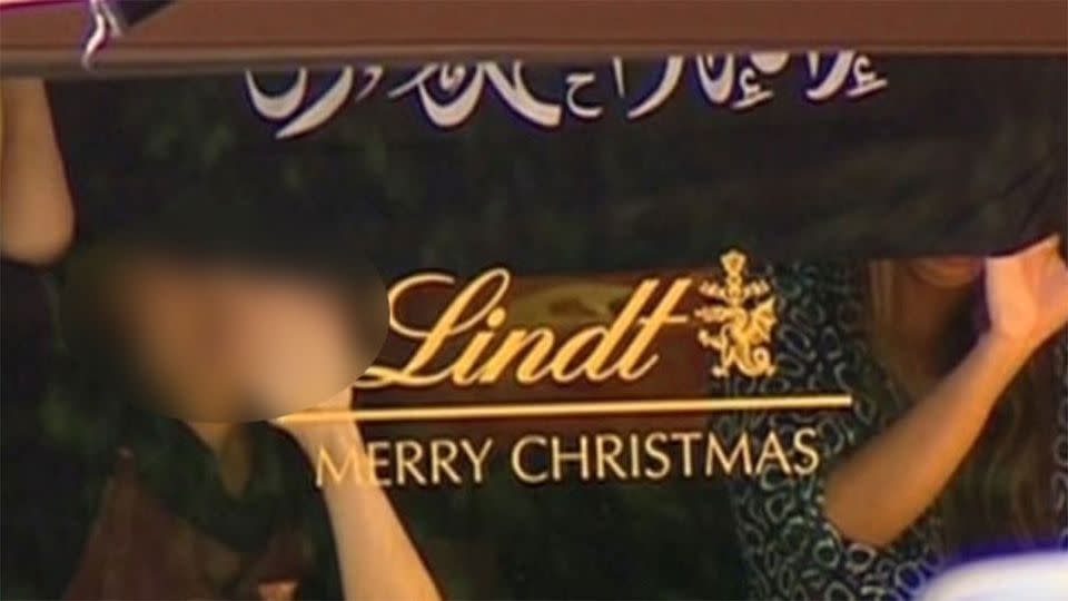 Two hostages inside the Lindt Cafe. Image: 7News.