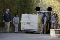 Zoo keepers walk with giant panda Bao Bao as she is carried in a crate for her new home in China from the National Zoo in Washington, DC, U.S. February 21, 2017. REUTERS/Joshua Roberts