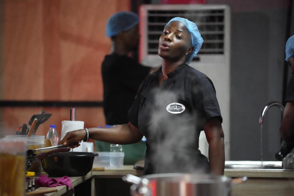 Chef, Hilda Baci, cooked to establish a new Guinness world record , for the "longest cooking marathon". The 97-hour cook-a-thon in Lagos, Nigeria. Saturday, May. 13, 2023. A Nigerian chef on Monday continued her quest to set a new global record for the longest hours of nonstop cooking after surpassing the current record of 87 hours and 45 minutes. By 15:00 GMT on Monday, Hilda Baci had cooked for more than 97 hours, becoming a national sensation and to the cheering of many in Nigeria's commercial hub of Lagos where her kitchen is set. (AP Photo/Sunday Alamba)