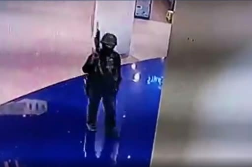 Barricaded Thai shoppers were able to receive updates on the movements of the soldier gunman via CCTV, from which this video grab came after a release by a Thai television station