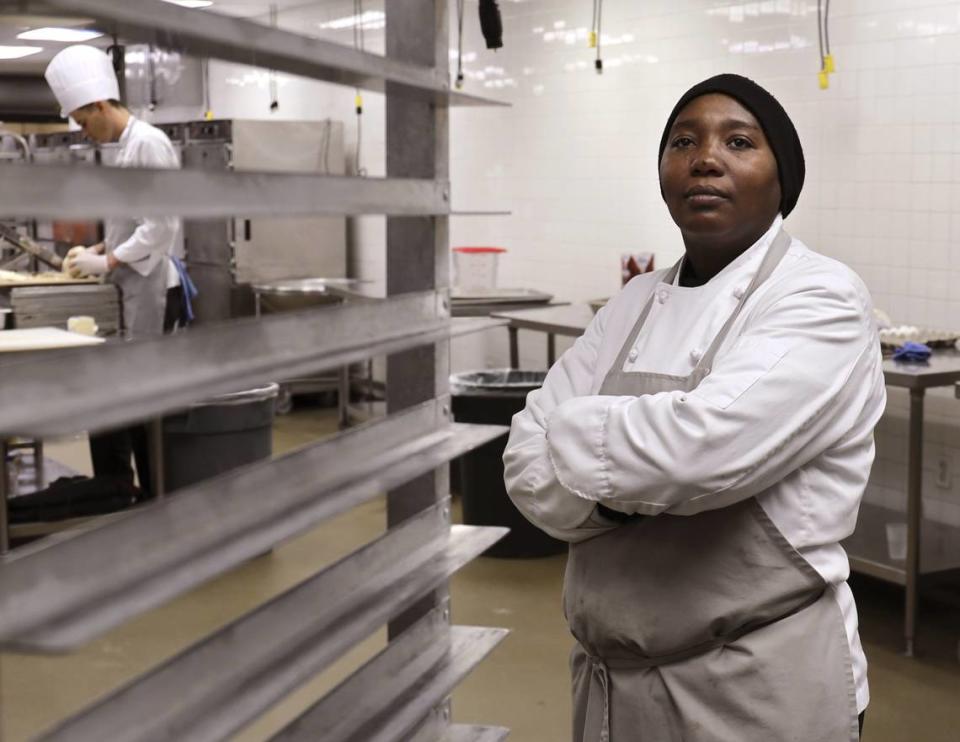 On Monday, November 25, 2019, Michelle Phillips, 33, right, is photographed in the banquet kitchen of the Fontainebleau resort in Miami Beach after graduating from a new culinary training program in Overtown last year.