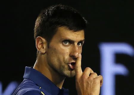Serbia's Novak Djokovic gestures to a member of the audience to be quiet during his semi-final match against Switzerland's Roger Federer at the Australian Open tennis tournament at Melbourne Park, Australia, January 28, 2016. REUTERS/Tyrone Siu
