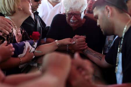 Family and friends attend the funeral of Angel Candelario, one of the victims of the shooting at the Pulse night club in Orlando, at his hometown of Guanica, Puerto Rico, June 18, 2016. REUTERS/Alvin Baez