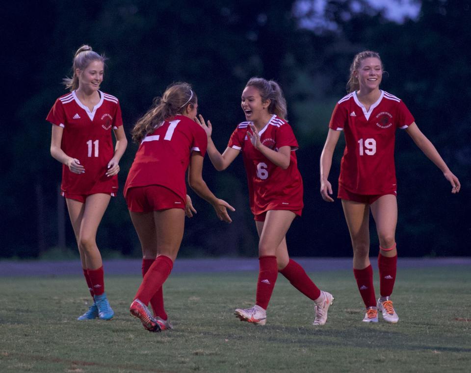 South Point players celebrate a second half goal during their 6-0 win over Stuart Cramer on May 19, 2022.