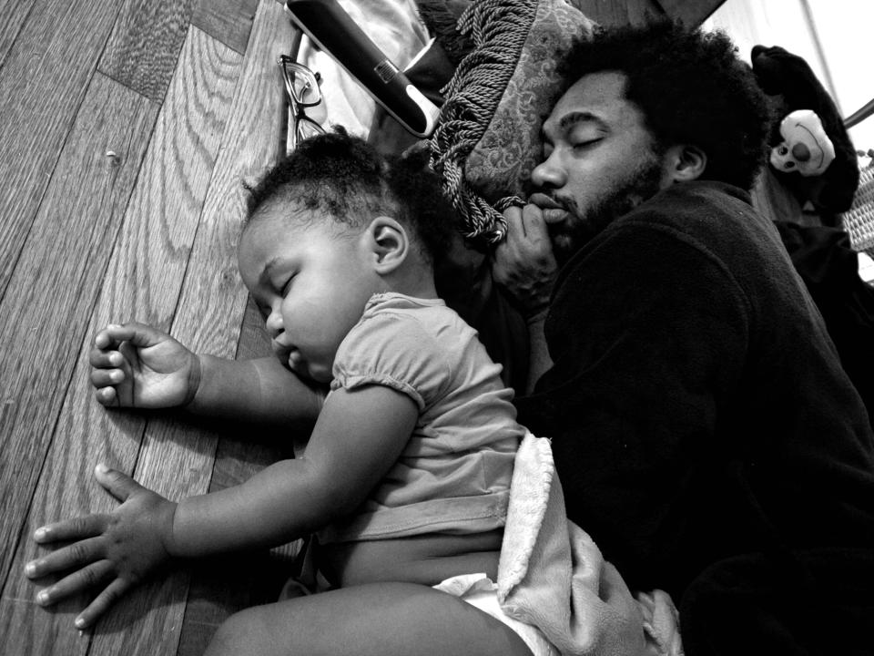 <p>Anthony Francis falls asleep in front of his TV with daughter Tena, Camp Lejeune, N.C., 2012. (Photograph © Zun Lee) </p>