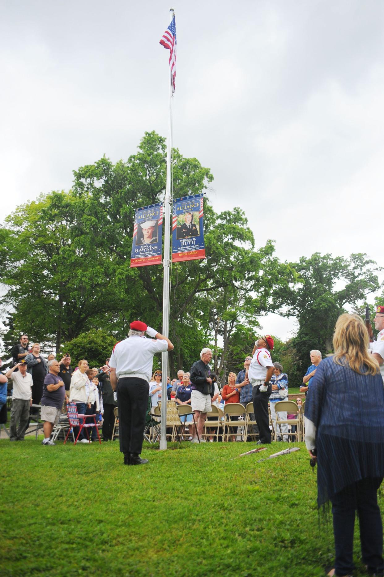 Members of the American Legion color guard salute as the flag is raised at the start of a 9/11 Gold Star memorial service Saturday, May 28, 2022, at Silver Park.