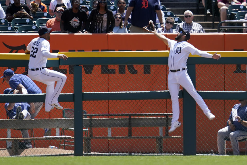 Detroit Tigers center fielder Riley Greene, right, can't reach a Kansas City Royals' Emmanuel Rivera two-run home run as right fielder Victor Reyes (22) looks on in the second inning of a baseball game in Detroit, Sunday, July 3, 2022. (AP Photo/Paul Sancya)
