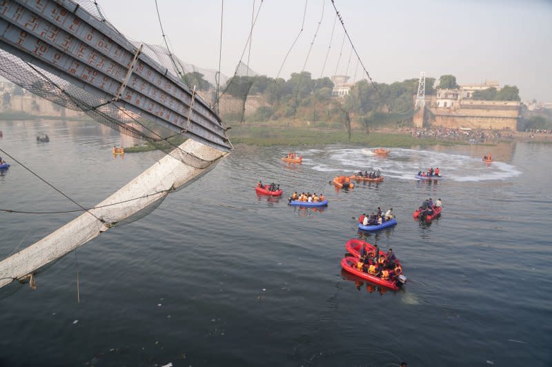 At least 17 workers were killed Wednesday when an under-construction bridge collapsed in India's Mizoram state. More are feared trapped as rescuers work to find them. Pictured is a suspension bridge collapse in Morbi, Gujarat, India, Oct. 31, 2022, that killed 135 people. File Photo by Siddharaj Solanki/EPA-EFE