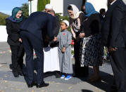Britain's Prince William greets a boy as New Zealand Prime Minister Jacinda Ardern watches during his arrival at Masjid Al Noor in Christchurch, New Zealand, April 26, 2019. REUTERS/Tracey Nearmy/Pool