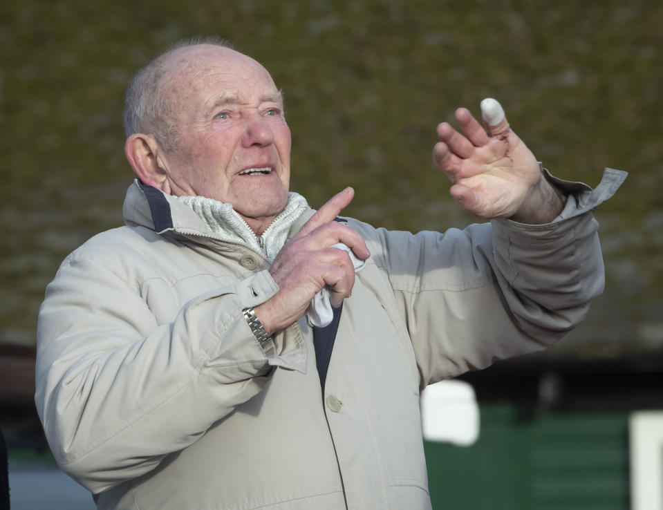 Tony Foulds, 82, reacts as warplanes from Britain and the United States stage a joint flypast tribute to Foulds and ten dead US airmen Friday Feb. 22, 2019, at Endcliffe Park in Sheffield, 75-years after Foulds witnessed the crash that killed them. Foulds was just a child playing in the park on Feb. 22, 1944, when a U.S. Air Force crew decided to crash and die rather than take the chance of hitting the playing children. For decades Foulds has tended a memorial dedicated to honouring the 10 U.S. airmen who died in the plane crash at Endcliffe Park, and today the flypast fulfils his wish for the men who saved his life. (Danny Lawson/PA via AP)