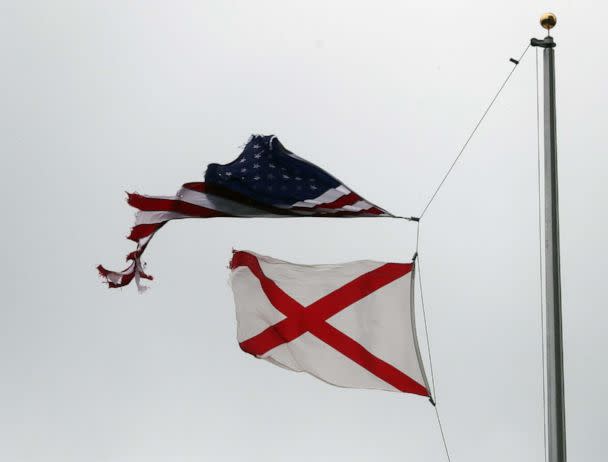 PHOTO: A tattered American flag is seen as the winds and rain from Hurricane Sally pass through the area on Sept. 16, 2020 in Mobile, Ala. (Joe Raedle/Getty Images)