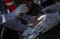 <p>A survivor baby Refi, receives treatment at emergency hospital following earthquake in Tanjung on Aug. 7, 2018 in Lombok Island, Indonesia. (Photo: Ulet Ifansasti/Getty Images) </p>