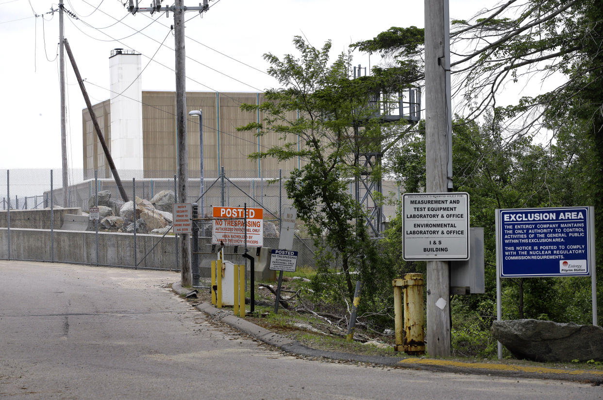 FILE - Warning signs are posted near a gate to the Pilgrim Nuclear Power Station on Tuesday, May 28, 2019, days before it stopped generating electricity, in Plymouth, Mass. The Biden administration is launching a $6 billion effort to save nuclear power plants at risk of closing, citing the need to continue nuclear energy as a carbon-free source of power that helps to combat climate change. (AP Photo/Steven Senne, File)