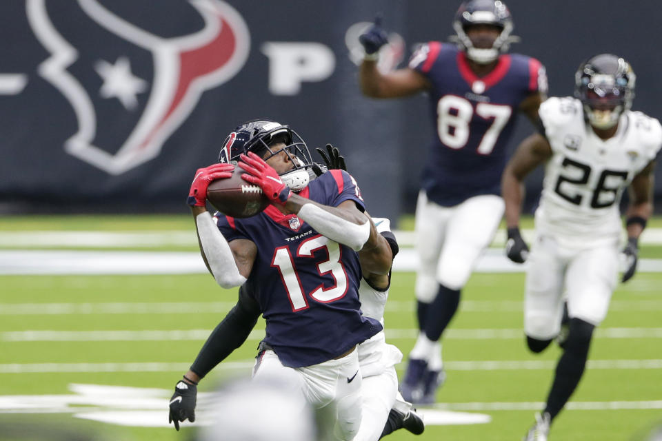 Houston Texans wide receiver Brandin Cooks (13) makes a catch against the Jacksonville Jaguars during the first half of an NFL football game Sunday, Oct. 11, 2020, in Houston. (AP Photo/Michael Wyke)