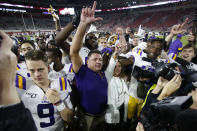 FILE - In this Nov. 9, 2019, file photo, LSU head coach Ed Orgeron celebrates with his players after defeating Alabama 46-41 in an NCAA college football game in Tuscaloosa, Ala. (AP Photo/John Bazemore, File)