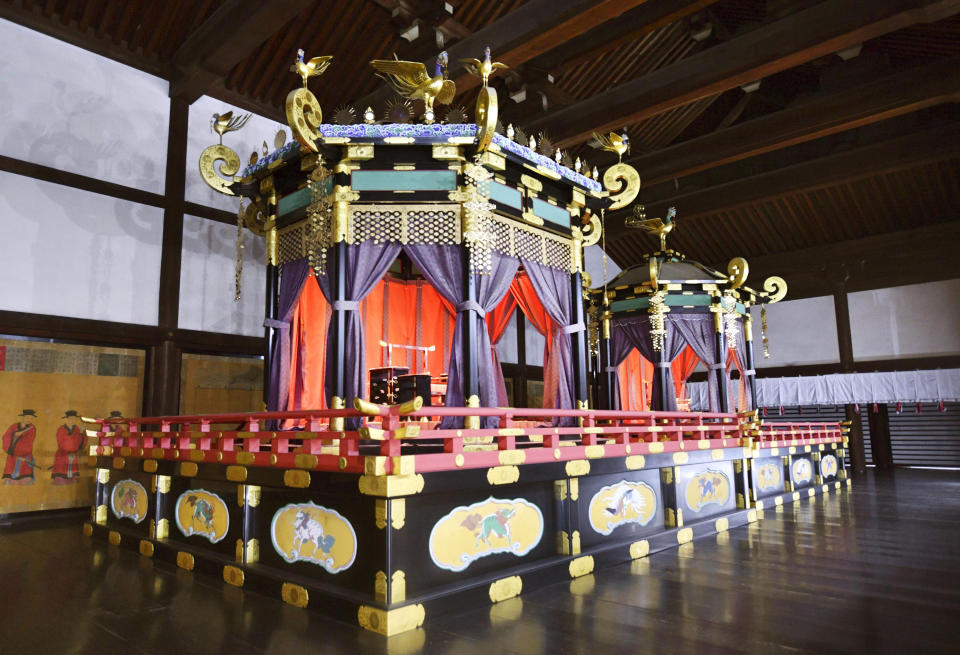 This April 17, 2018, photo shows Takamikura throne, left, and Michodai, a curtained platform, placed at the Kyoto Imperial Palace in Kyoto, western Japan. The special imperial throne for the coronation of Japan’s new emperor arrived in Tokyo on Wednesday, Sept. 26, 2018, from the ancient imperial palace in Kyoto more than a year ahead of time. The Takamikura throne will be used at a ceremony in October 2019 when Crown Prince Naruhito formally announces his succession. (Kyodo News via AP)