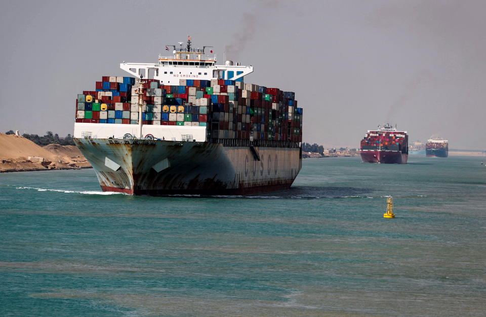 Shipping containers pass through the Suez Canal in Suez, Egypt February 15, 2022. Picture taken February 15, 2022. REUTERS/Mohamed Abd El Ghany