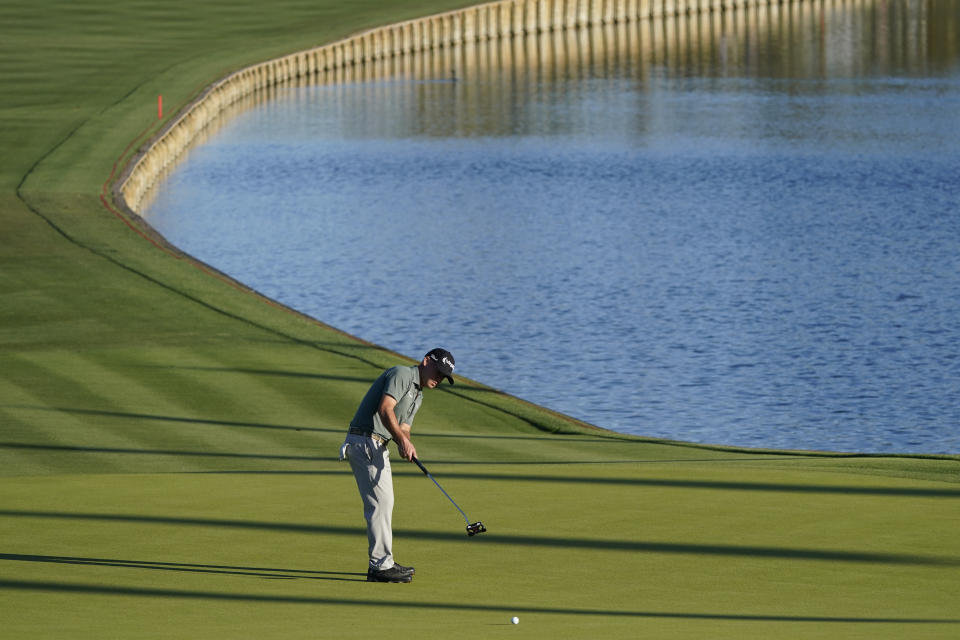 Brian Harman putts on the 18thth hole during the first round of the The Players Championship golf tournament Thursday, March 11, 2021, in Ponte Vedra Beach, Fla. (AP Photo/John Raoux)