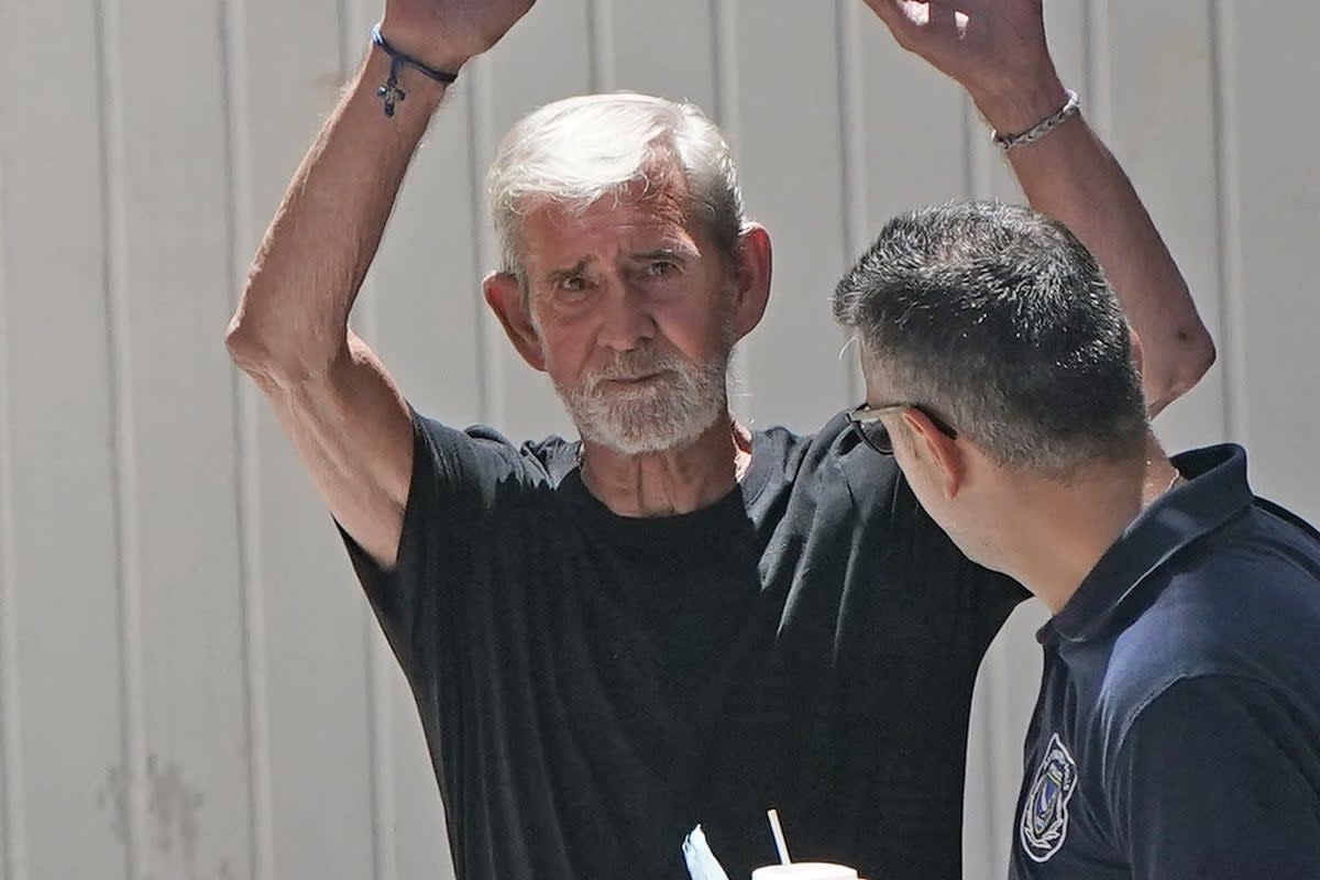 David Hunter is led away from Paphos District Court in Cyprus after he was found guilty by Cypriot judges of the manslaughter of his terminally ill wife Janice (PA Wire)