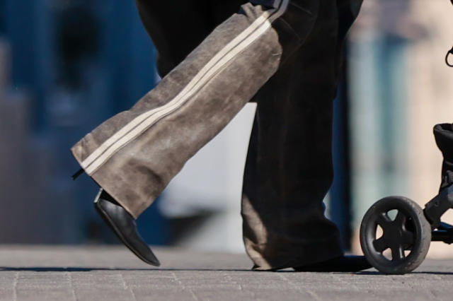 Julia Fox sports a fur coat with leather boots on a walk in New York with  one-year-old son Valentino