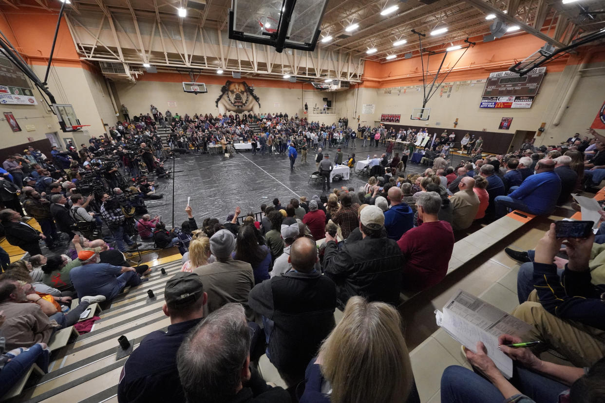 Trent Conaway, the mayor of East Palestine, Ohio, leads a town hall meeting at a local high school gym.