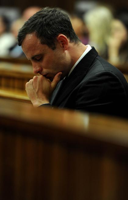 Oscar Pistorius listens to state prosecutor summarize his evidence Thursday. (AP)