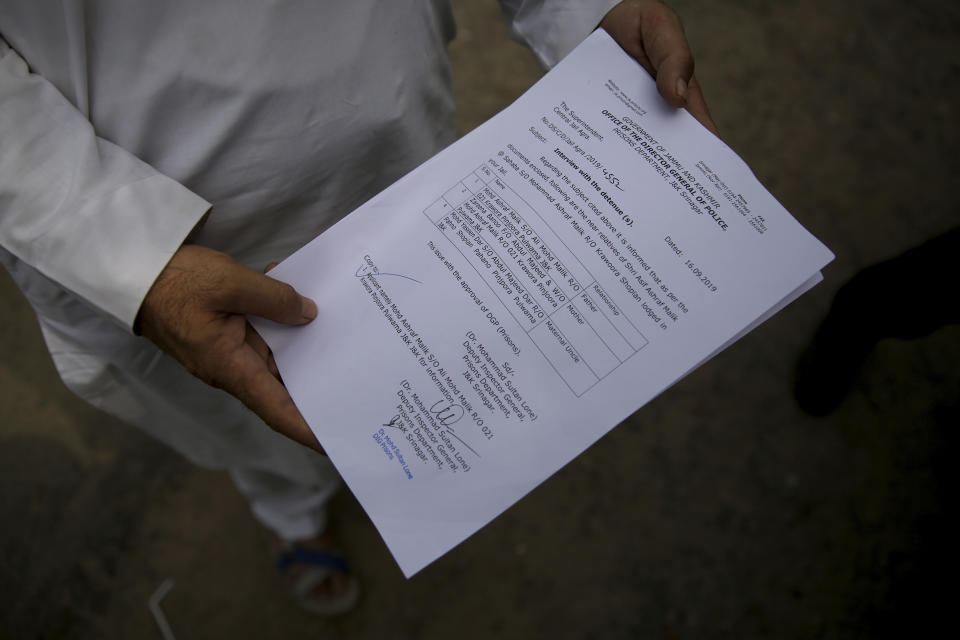 Mohammad Ashraf Malik, a Kashmiri man whose son is lodged in Agra Central Jail, shows a permission letter to meet his son as he speaks with the Associated Press outside the jail, in Agra, India, Friday, Sept. 20, 2019. His son, Aasif Ashraf, is still recovering from three bullet wounds in his abdomen which he received during protests in March, Malik said. Arrested months before the day that Kashmir’s semi-autonomy was withdrawn, Aasif was moved to the jail in Agra after being rearrested by police in August. “Police arrested him from his hospital bed in Srinagar when he was being treated. They arrested and rearrested him so many times and then finally jailed him here,” Mohammad said. “Which country in the world jails an injured person who is recovering from bullet wounds?” (AP Photo/Altaf Qadri)