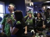 Seattle Seahawks fans watch Super Bowl XLIX at the Hawks Nest bar in Seattle, Washington February 1, 2015. The Seahawks are defending their title against the New England Patriots on Sunday in Glendale, Arizona. REUTERS/Jason Redmond (UNITED STATES - Tags: SPORT FOOTBALL)