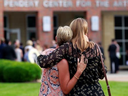 Mourners stand out side the art center before a funeral service for Otto Warmbier, who died after his release from North Korea, at Wyoming High School in Wyoming, Ohio, U.S. June 22, 2017. REUTERS/John Sommers II