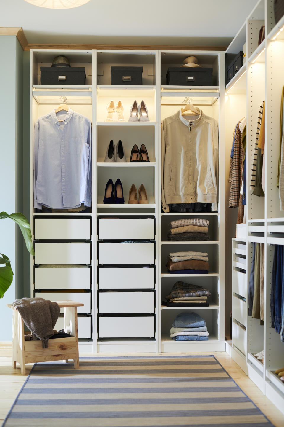 <p> One consideration when designing your own walk-in closet is to choose what combinations of storage will work best. Do you prefer to have more hanging items or do you like to keep things neatly folded in drawers or on shelves? This Ikea Pax combination shows you how to use both successfully within this corner closet.  </p>