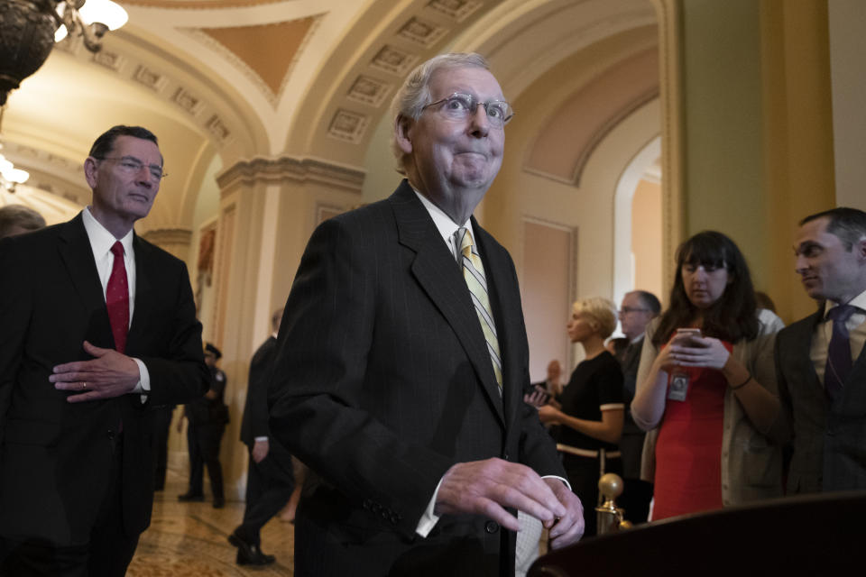 Senate Majority Leader Mitch McConnell, R-Ky., joined at left by Sen. John Barrasso, R-Wyo., answers questions about Senate Intelligence Committee Chairman Richard Burr, R-N.C., and his decision to subpoena Donald Trump Jr. who had backed out of two scheduled interviews as part of the panel's Russia investigation, during a news conference at the Capitol in Washington, Tuesday, May 14, 2019. (AP Photo/J. Scott Applewhite)