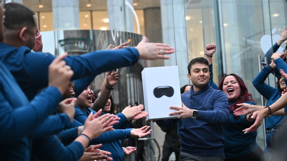 The first customer walks out of the Apple Store with his purchase of the Vision Pro headset in New York on February 2, 2024. The Vision Pro, the tech giant's $3,499 headset, is its first major release since the Apple Watch nine years ago. - Angela Weiss/AFP/Getty Images