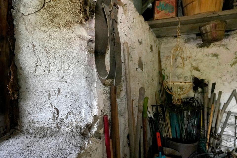 The initials of Annie Elizabeth Bradley, the granddaughter of original homesteader Ellen Hemlock are seen inside the summer kitchen at the home of Tom and Susan Felmer on June 22, 2023 in Cedarburg.