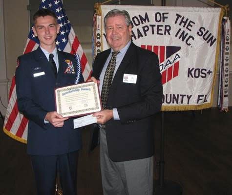 Joshua Lathrop of Dunnellon High School received a $1,000 KOS Scholarship Award check from KOS President Joe Voge on May 5.