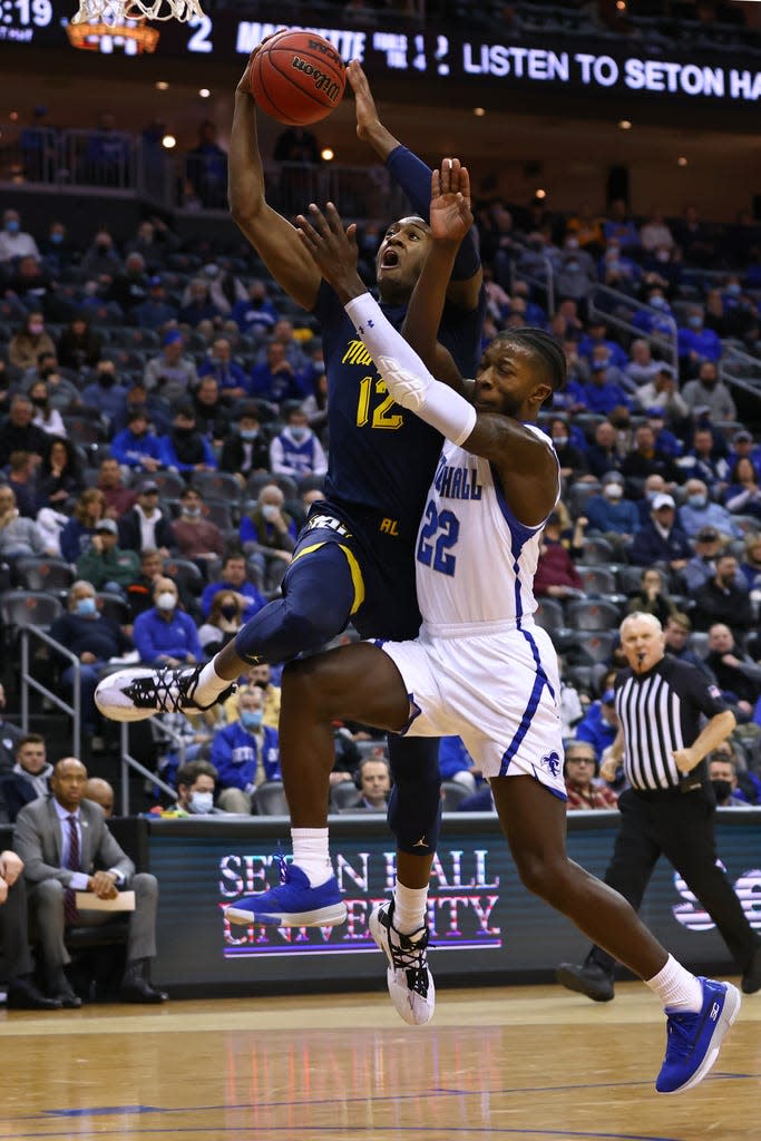 Marquette's Olivier-Maxence Prosper soars to the basket in the first half against Seton Hall's  Myles Cale in the first half on Wednesday.
