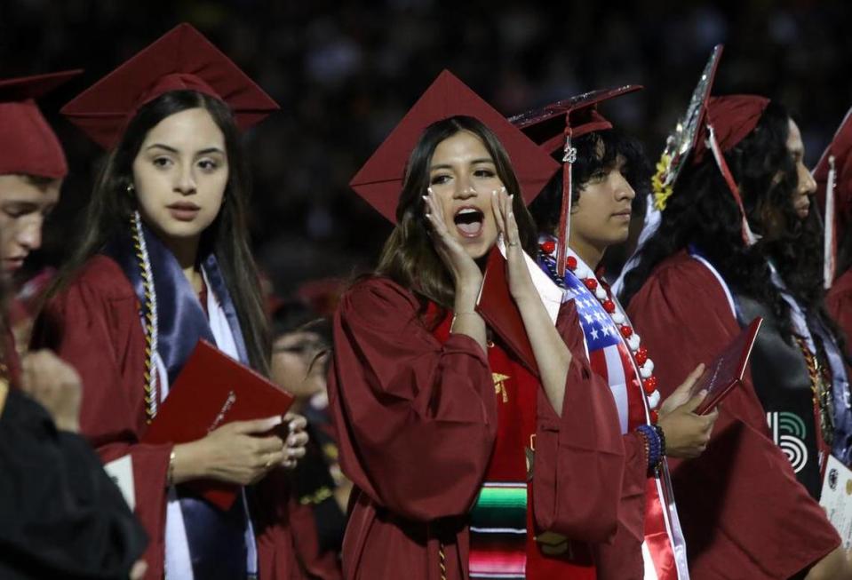 A graduate cheers during the first graduation ceremony for Matilda Torres High School at Madera Memorial Stadium on June 10, 2023.