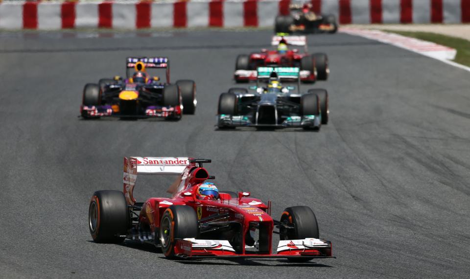 Ferrari's Fernando Alonso takes the lead during the Spanish Grand Prix at the Circuit de Catalunya, Barcelona, Spain.