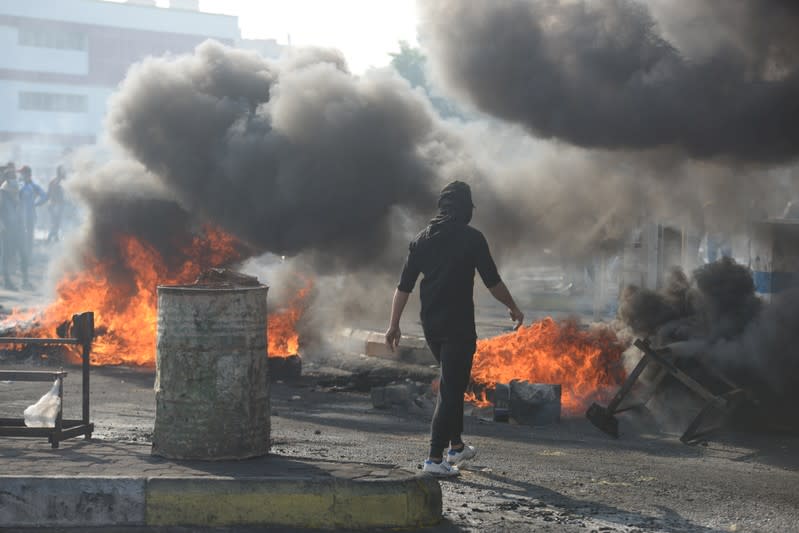 An Iraqi demonstrator is seen during ongoing anti-government protests,in Nassiriya