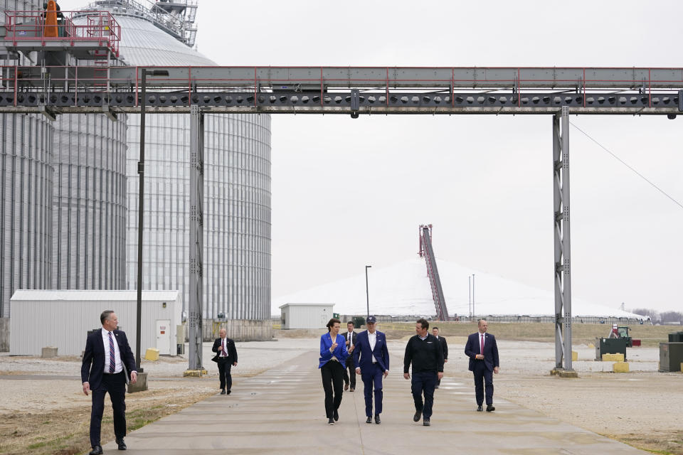 President Joe Biden and Rep. Cindy Axne, D-Iowa, talk with Jack Mitchell, regional vice president of POET Bioprocessing, right, as he gives them a tour at POET Bioprocessing in Menlo, Iowa, Tuesday, April 12, 2022. (AP Photo/Carolyn Kaster)