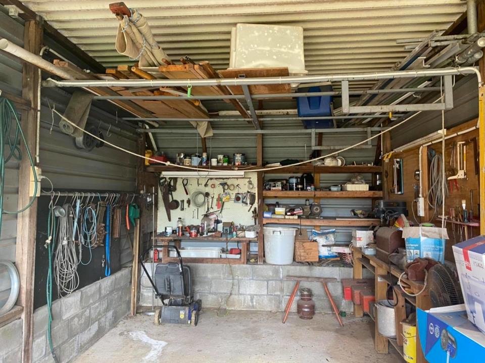 Social media users were left baffled after a snake catcher shared a photo of a garage where a snake was supposedly hiding. Can you see it? Photo: Facebook