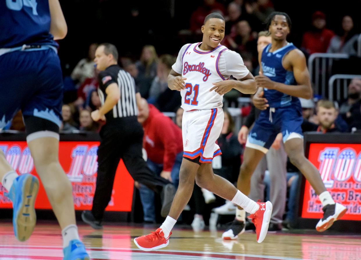 Bradley's Duke Deen flashes a smile after sinking a three-pointer against UIC in the second half Saturday, Dec. 31, 2022 at Carver Arena. The Braves dominated the Flames 79-45.