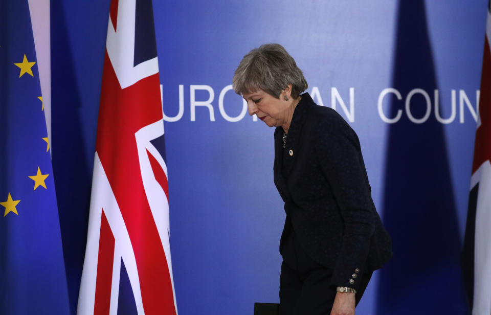 British Prime Minister Theresa May leaves after addressing a media conference at an EU summit in Brussels, Friday, March 22, 2019. Worn down by three years of indecision in London, EU leaders on Thursday were grudgingly leaning toward giving the U.K. more time to ease itself out of the bloc. (AP Photo/Frank Augstein)